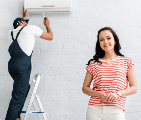 Professional AC technician is looking at ac